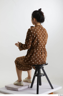 Aera  1 brown dots dress casual dressed sitting white…